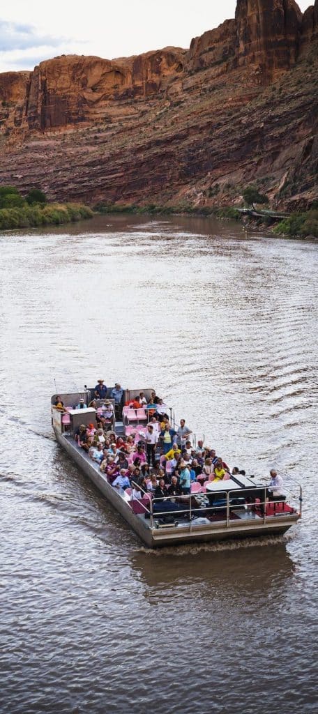 Audience members at the Moab Music Festival take in a concert by music director Michael Barrett on a barge floating down the Colorado River | Photo: Richard Bowditch